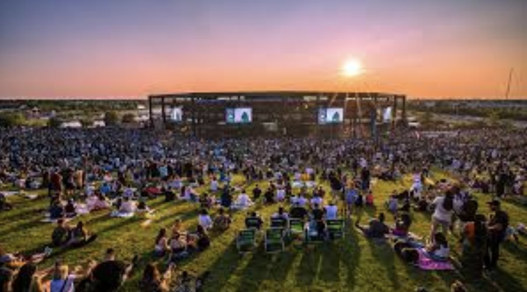 Credit Union 1 Amphitheatre lawn crowd at sunset
